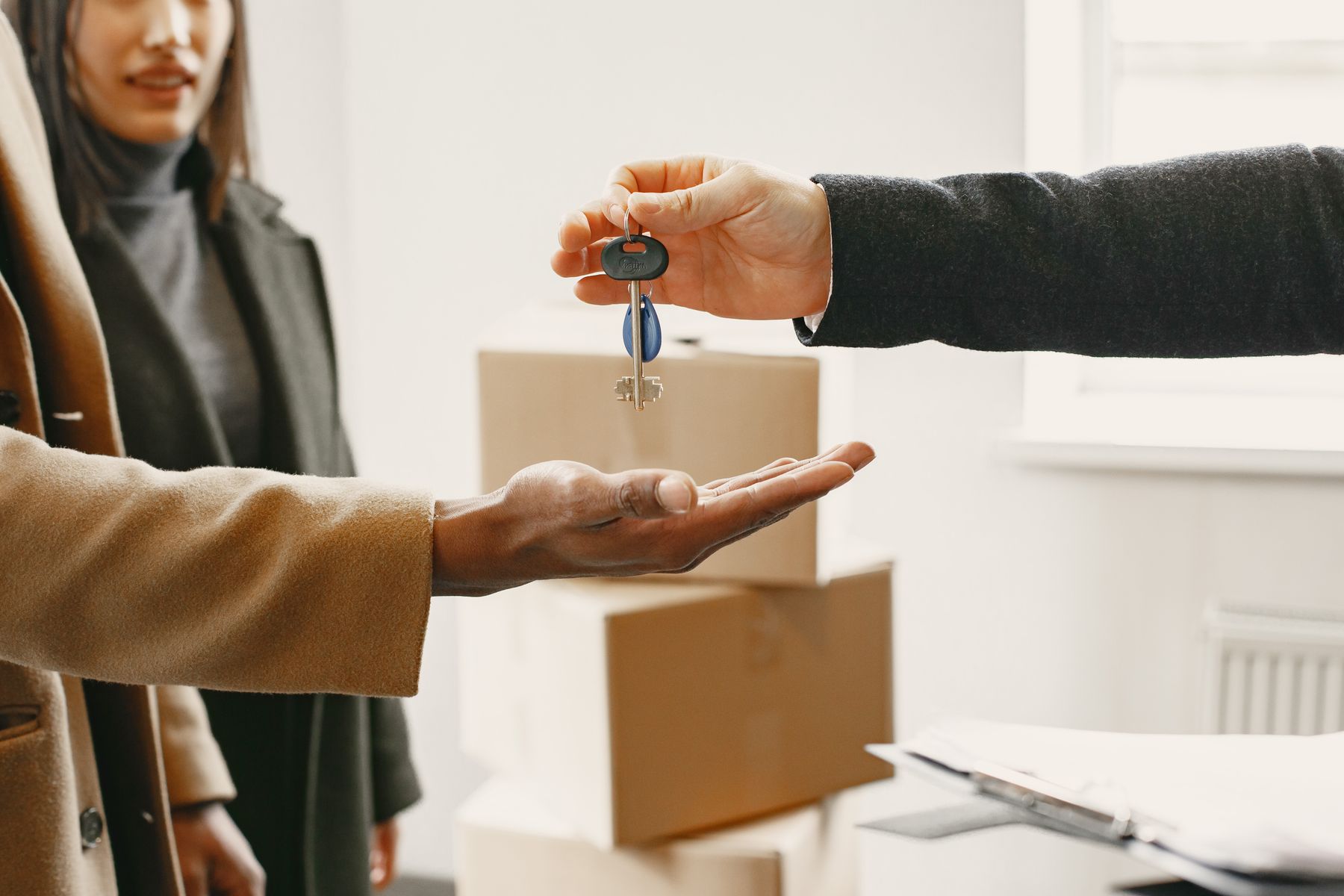 A new homeowner receiving keys