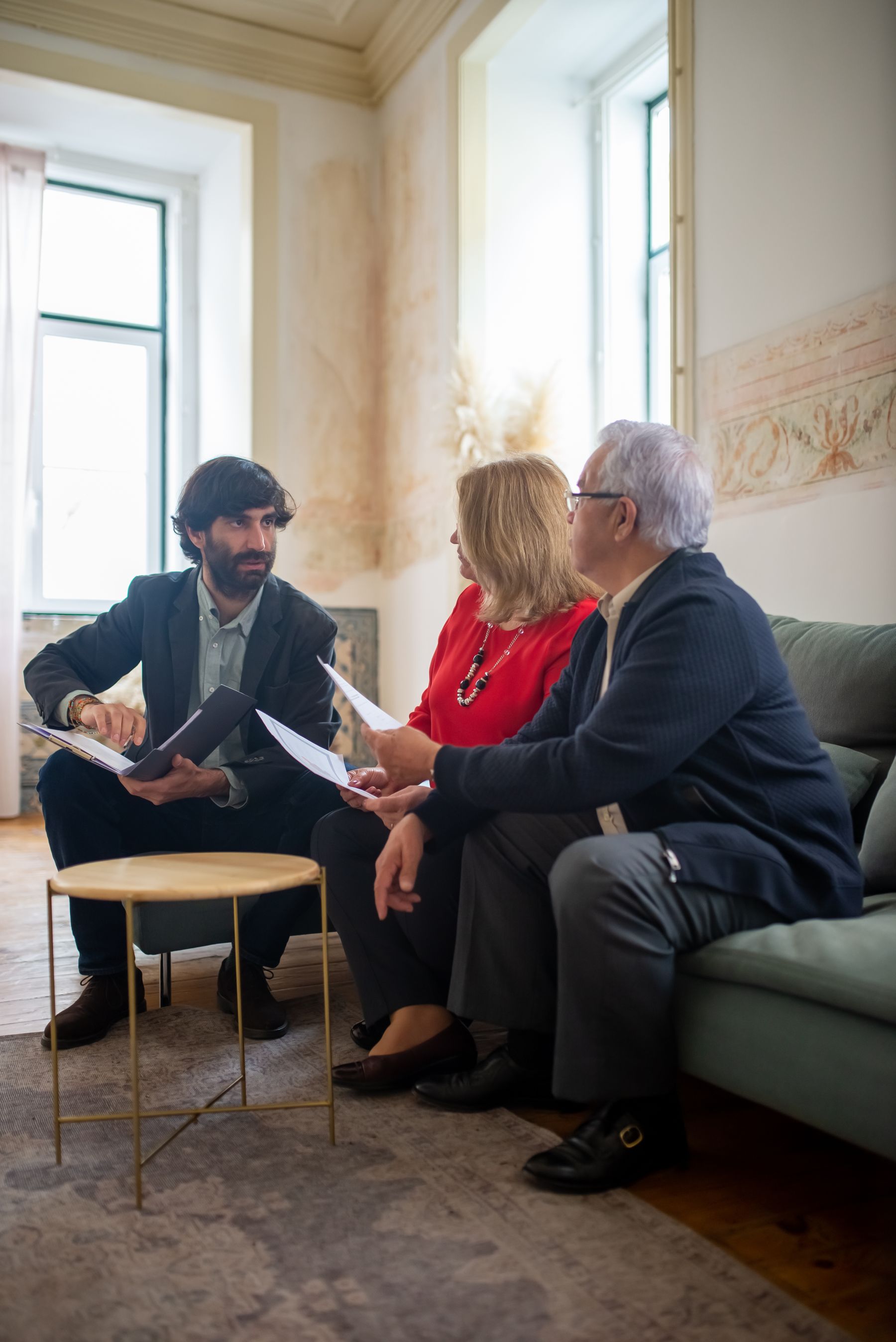 Senior couple discussing retirement decisions with an advisor