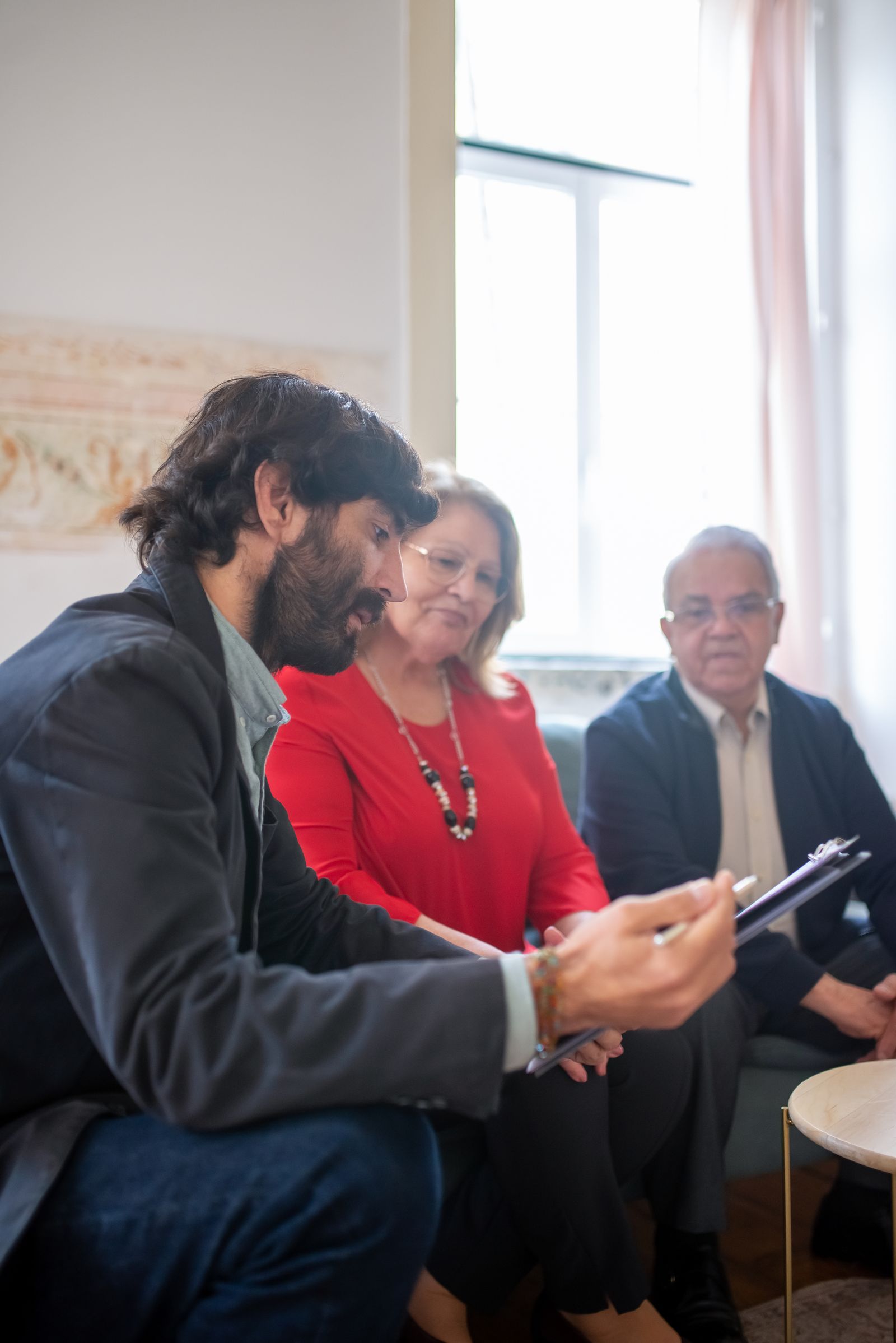 Senior clients reviewing Medicare and healthcare decisions with an advisor
